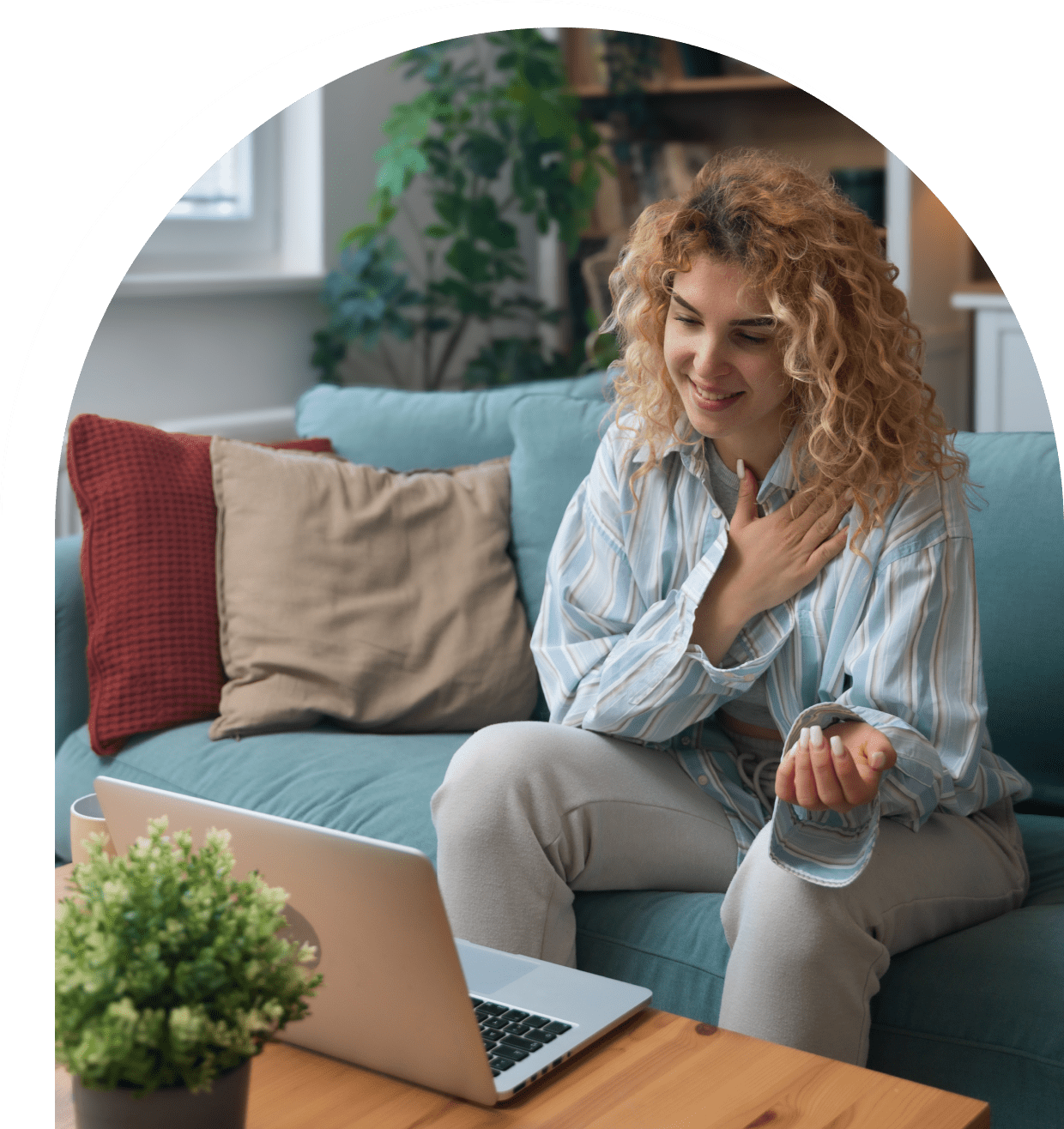 Woman video chatting on a laptop.